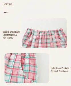 Détail d'un short en coton à carreaux rose et vert avec taille élastique et poches