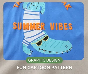 Detail of cartoon crocodile print and Summer Vibes text on blue cotton boy's t-shirt