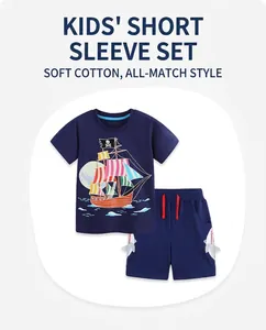 Detail of navy kids set with cartoon pirate ship print and grey shark pocket shorts