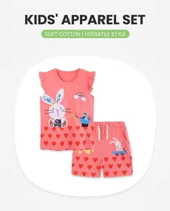 Detailed view of pink cotton kids set with rabbit rainbow print and red heart pattern