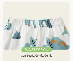 Detail of elastic waistband on boys' cotton knit shorts with blue dinosaur print