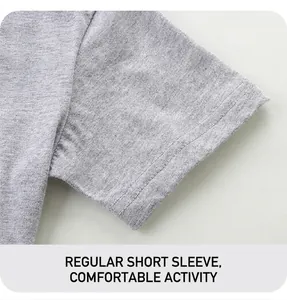 Detail of grey cotton knit fabric and double-stitched hem on the boy's short sleeve T-shirt
