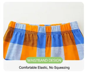 Detail view of boys' plaid shorts featuring an elastic waistband with durable double stitching