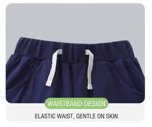 Detail of navy blue kids shorts with elastic waistband and white cotton drawstring cord