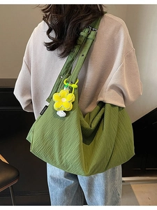 Minimalist green pleated canvas tote bag for women with yellow sunflower charm accessory
