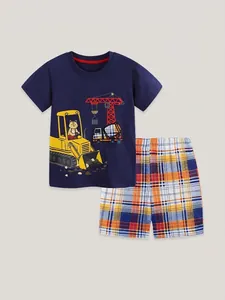 Boys summer outfit featuring navy excavator print T-shirt and orange plaid shorts set