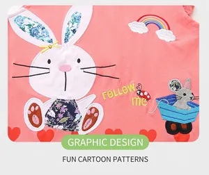 Detail of pink knitted shirt with rabbit embroidery and cartoon applique designs