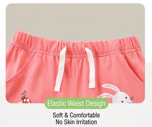 Detail of coral pink kids cotton shorts with elastic waistband and cute rabbit print