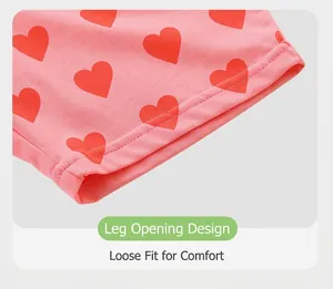 Close-up of pink cotton knit shorts with red heart patterns and neat flatlock stitching