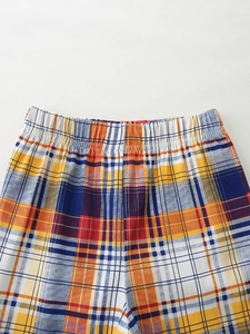 Boys' summer shorts set featuring vibrant plaid pattern with elastic waistband detail
