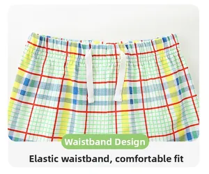 Detail of boys plaid shorts with elastic waistband and white functional drawstring