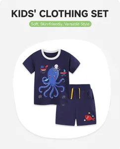 Close-up of navy blue cotton kids summer set with cartoon octopus and boat prints