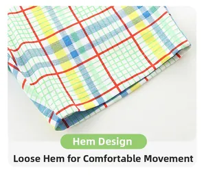 Detail of colorful plaid shorts showing high-quality stitching and breathable cotton fabric