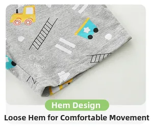 Detail of grey cotton shorts showing a loose hem and cartoon train print with Choo choo text