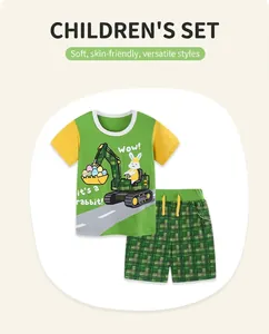 Detailed view of kids cotton t-shirt with excavator print and green plaid shorts set