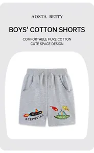 Close-up of boys gray cotton shorts with high-quality space embroidery and drawstring waist