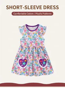 Detail of purple cotton girls' dress with heart pockets and floral patterns