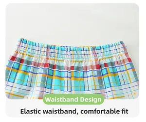 Détail du short à carreaux coloré avec taille élastique pour un ajustement enfant