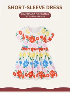 Close-up of soft cotton fabric and vibrant floral print on girl's summer dress