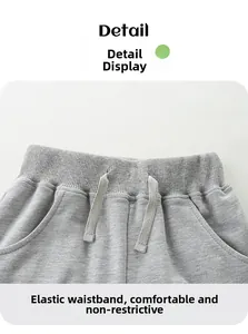 Detail view of grey knit shorts with elastic waistband and drawstring for boys