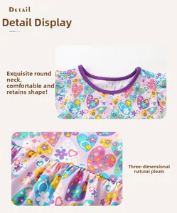 Detail view of round neckline and ruffled layers on purple floral girl's cotton dress