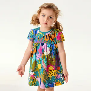 Close-up of girls peacock blue summer dress with tropical animal and jungle prints