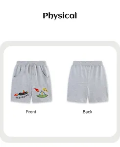 Detail of grey cotton shorts for boys featuring rocket embroidery and drawstring waist