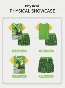 Detail of boys' green plaid shorts and cotton t-shirt with cartoon excavator print