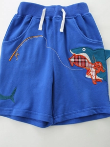 Blue boys knit cotton shorts featuring a shark embroidery patch and white drawstring