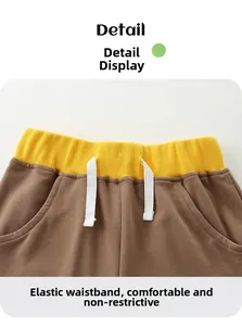 Detail der Kinder-Shorts mit elastischem gelbem Bund und bequemem weißem Kordelzug