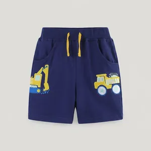 Detail of dark blue toddler shorts with elastic drawstring and yellow excavator print