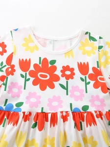Girl's summer cotton dress featuring vibrant floral print and a classic round neck design