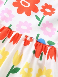Girl's summer cotton dress featuring vibrant floral patterns and fine pleated stitching details