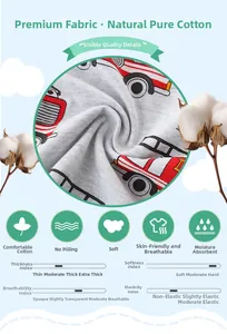 Detail of soft gray cotton fabric with a red fire truck print and cotton plant accents