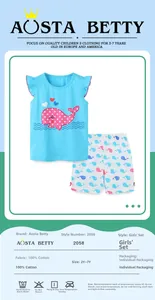 Detail of girls 100% cotton summer set featuring blue whale tank top and printed shorts