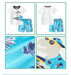 Detail view of cotton summer set featuring cartoon dinosaur print and palm tree patterns