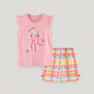 Detail of pink girls outfit with cartoon jellyfish print top and plaid shorts
