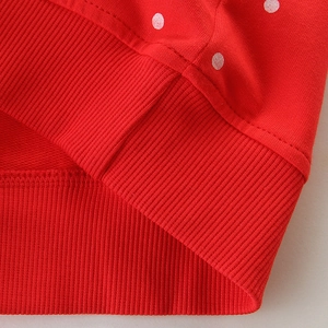 Girls' red long-sleeve sweatshirt with white polka dots and ribbed hem detailing