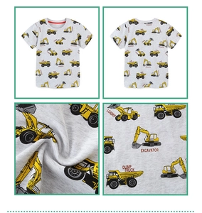 Detail view of grey cotton kids T-shirt with yellow excavator and dump truck patterns