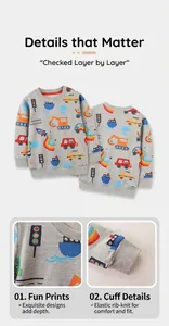 Detail view showing colorful cartoon prints and elastic ribbed cuffs on gray kid's sweatshirt