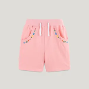 Pink cotton shorts for girls with floral embroidery and white drawstring detail