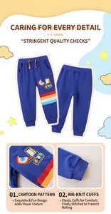 Detail of navy boy's joggers featuring excavator print and yellow drawstring waist