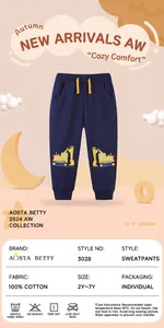 Detail of navy blue cotton boys' sweatpants featuring yellow excavator embroidery and drawstring
