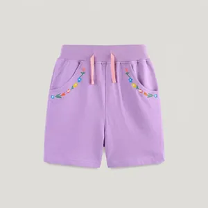 Detail of lavender cotton knit shorts with rainbow floral embroidery and pink drawstring