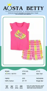 Detail of girls pink tank top with watermelon embroidery and plaid shorts set