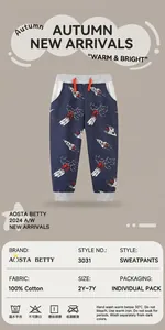 Close-up of boys cotton joggers featuring rocket space prints and ribbed ankle cuffs