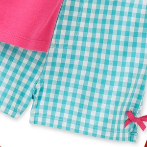 Ensemble d'été pour filles avec haut en maille et bas à carreaux avec nœud en ruban