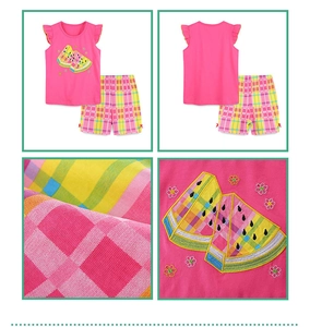 Detail view of pink sleeveless top with watermelon embroidery and plaid shorts set