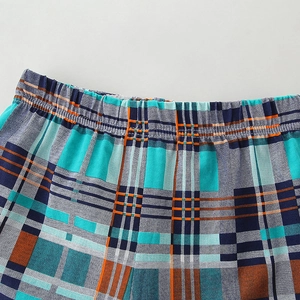 Classic plaid cotton shorts for boys featuring a comfortable elastic waist and woven texture