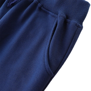 Boys navy blue dinosaur joggers featuring elastic drawstring waist and side pockets